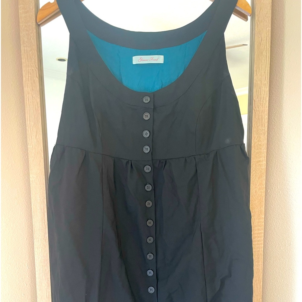 Geren Ford. Size medium. Black midi dress with black buttons down the front.